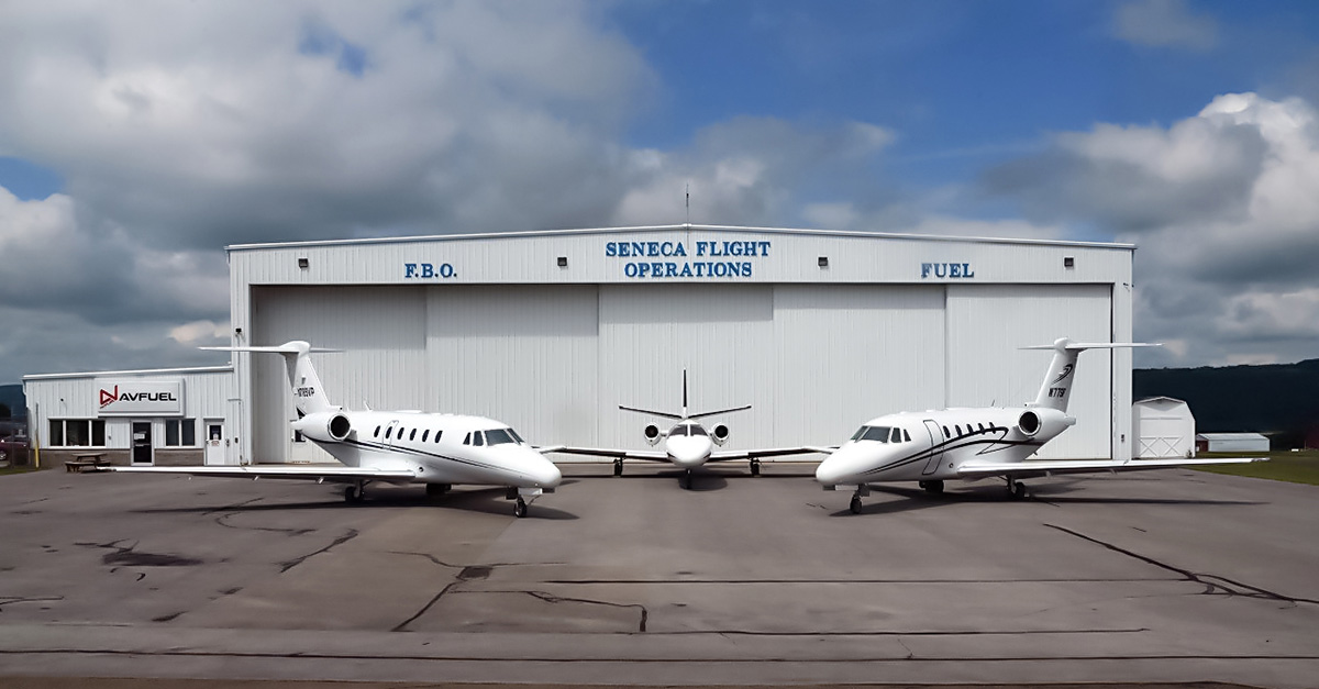 Seneca Flight Operations FBO hangar with three Citation jets on the ramp